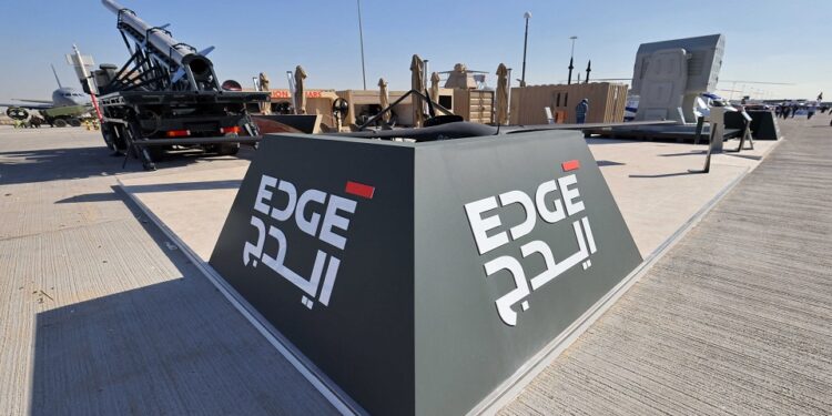 This picture taken on November 14, 2021 shows a view of the logo of EDGE advanced technology group for defence at the 2021 Dubai Airshow in the Gulf emirate. (Photo by Giuseppe CACACE / AFP)